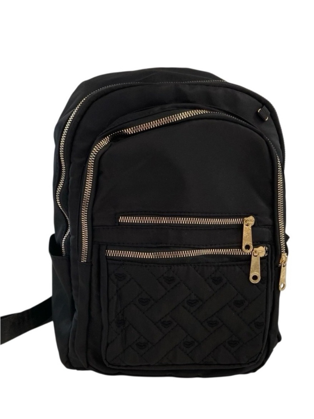 Sleek black quilted backpack with gold zipper accents versatile daily bag